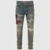 Amiri RED SNAKE THRASHER JEAN